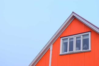 Roof of house and sky.