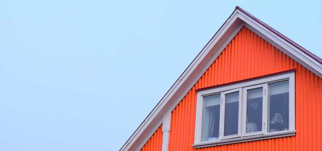 Roof of house and sky.